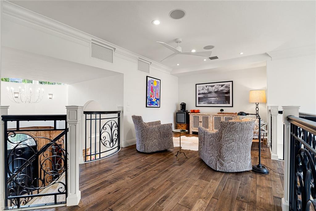 248 Point Salerno Naples, FL 34108 - Photo 29 of 42 a living room with furniture and a flat screen tv