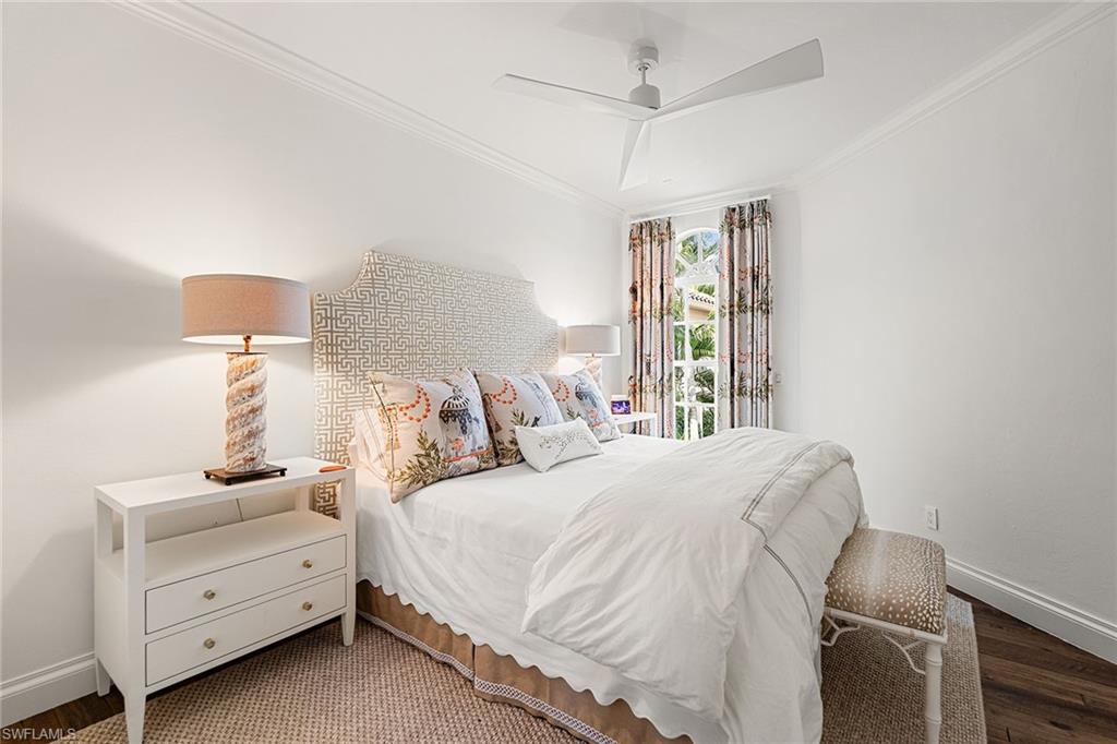 248 Point Salerno Naples, FL 34108 - Photo 34 of 42 a bedroom with a bed and a night stand