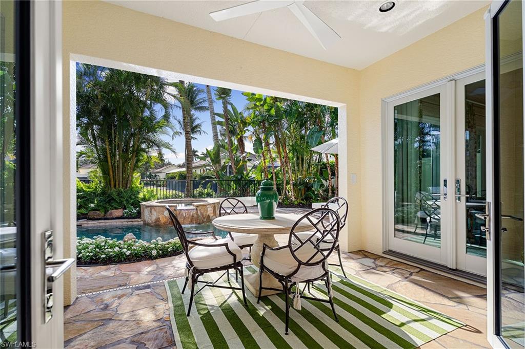 248 Point Salerno Naples, FL 34108 - Photo 7 of 42 a view of two chairs in a patio