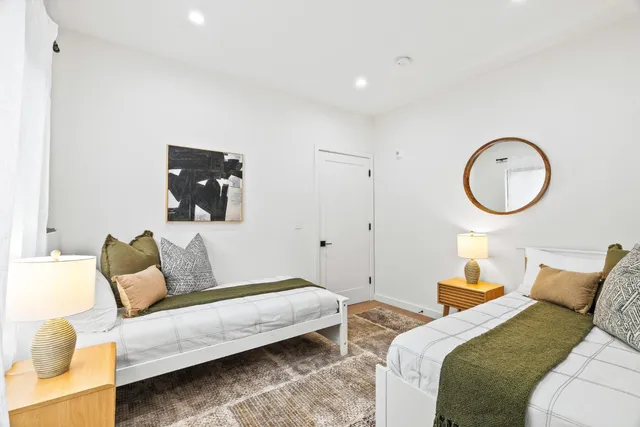 a bedroom with bed and a couch