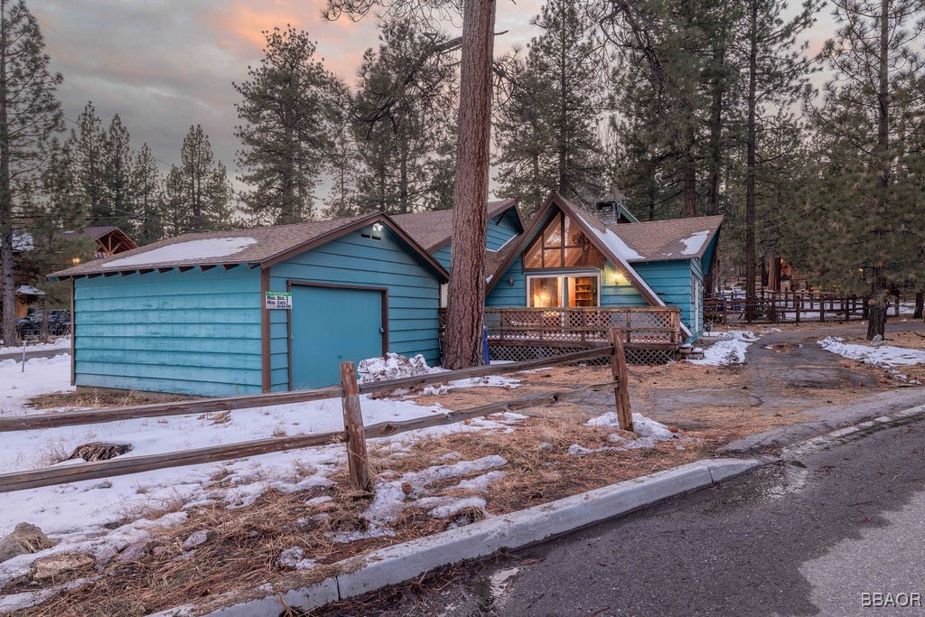 684 Chipmunk Lane Big Bear Lake, CA 92315 - Photo 29 of 49 a house with trees in the background