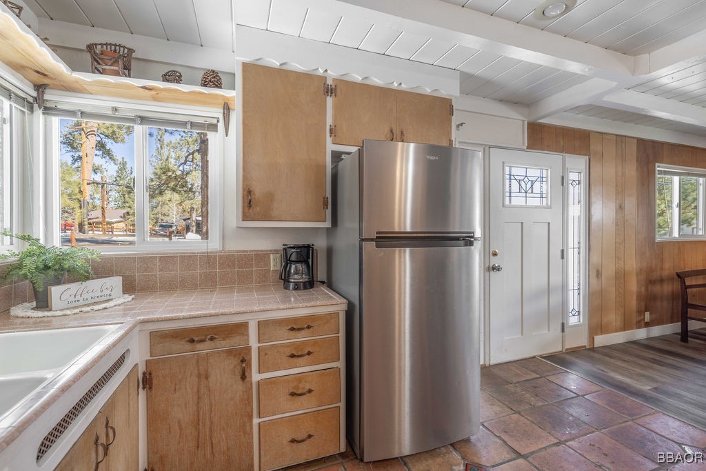 684 Chipmunk Lane Big Bear Lake, CA 92315 - Photo 9 of 49 a kitchen with a refrigerator and a sink