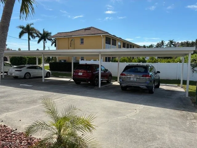 a view of a cars park in front of house
