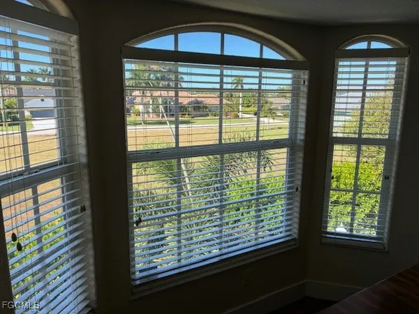 a view of a room that has a large window