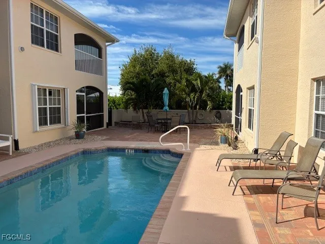 a view of a swimming pool with a lounge chairs