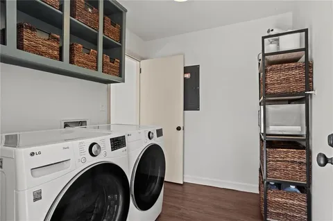 a view of livingroom with washer and dryer