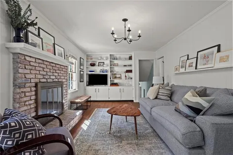 a living room with furniture or couch and a fireplace