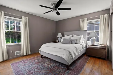 a bed room with a bed and a window