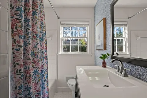 a bathroom with a sink and a window