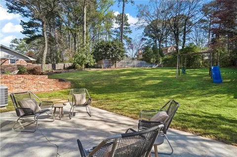 a view of a chairs and table in the garden