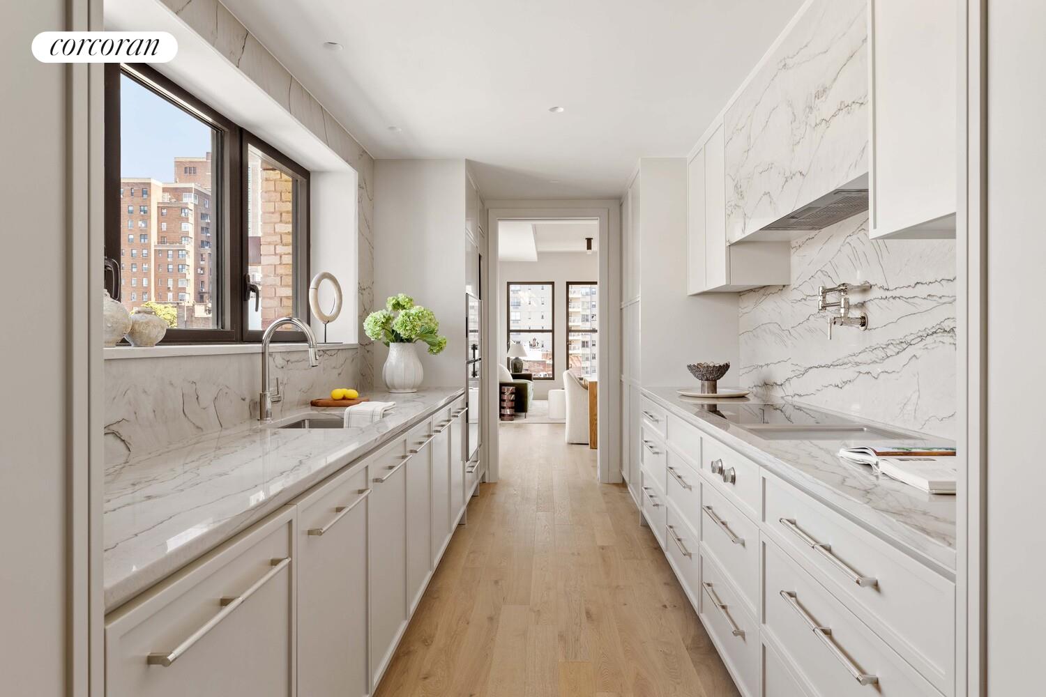 181 MacDougal Street, Unit PH Manhattan, NY 10011 - Photo 9 of 26 a kitchen with sink a stove and white cabinets
