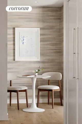 a kitchen with sink a stove and white cabinets