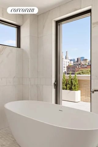 a bed room with a bed window and a flat screen tv