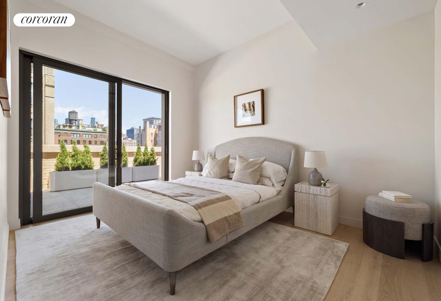 181 MacDougal Street, Unit PH Manhattan, NY 10011 - Photo 16 of 26 a spacious bedroom with a bed and a large window