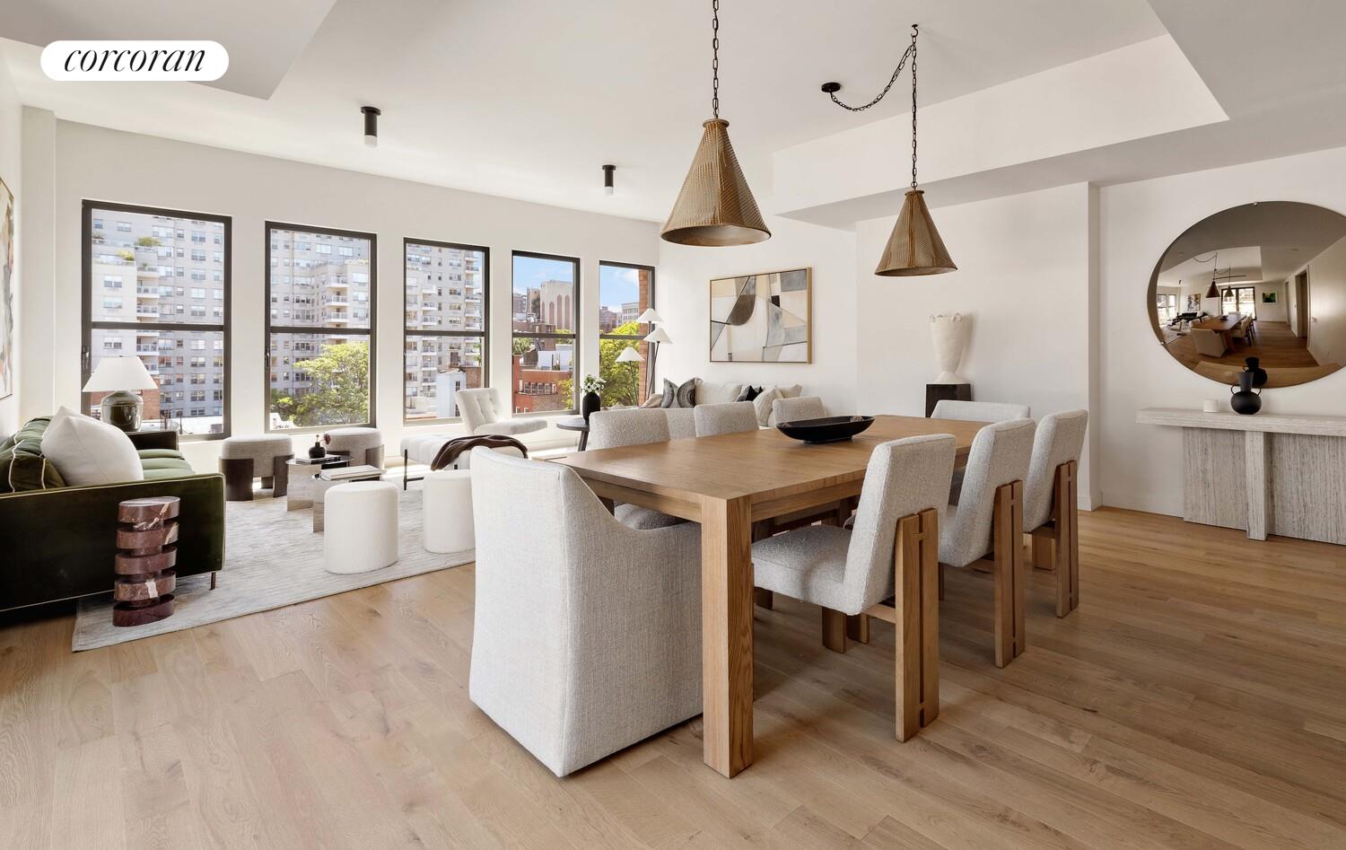 181 MacDougal Street, Unit PH Manhattan, NY 10011 - Photo 4 of 26 a dining room with furniture a chandelier and wooden floor