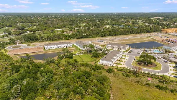 a view of a swimming pool with outdoor seating