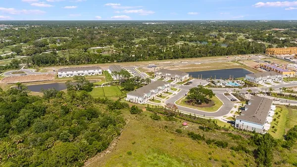 a view of a swimming pool and lounge chairs