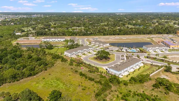 a view of a backyard with sitting area