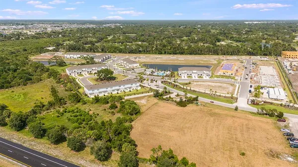 a view of a swimming pool with lounge chairs