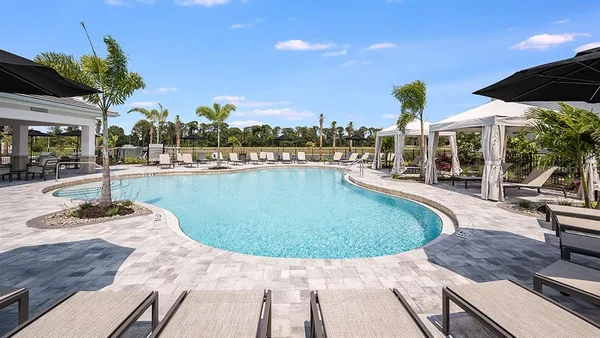 a view of a swimming pool with a patio