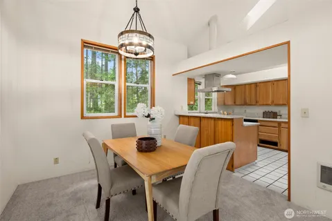 a view of a dining room with furniture window and outside view