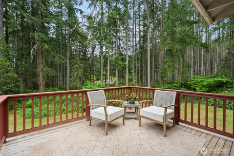 a view of a two chairs in the deck
