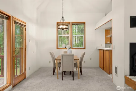 a view of a dining room with furniture window and outside view