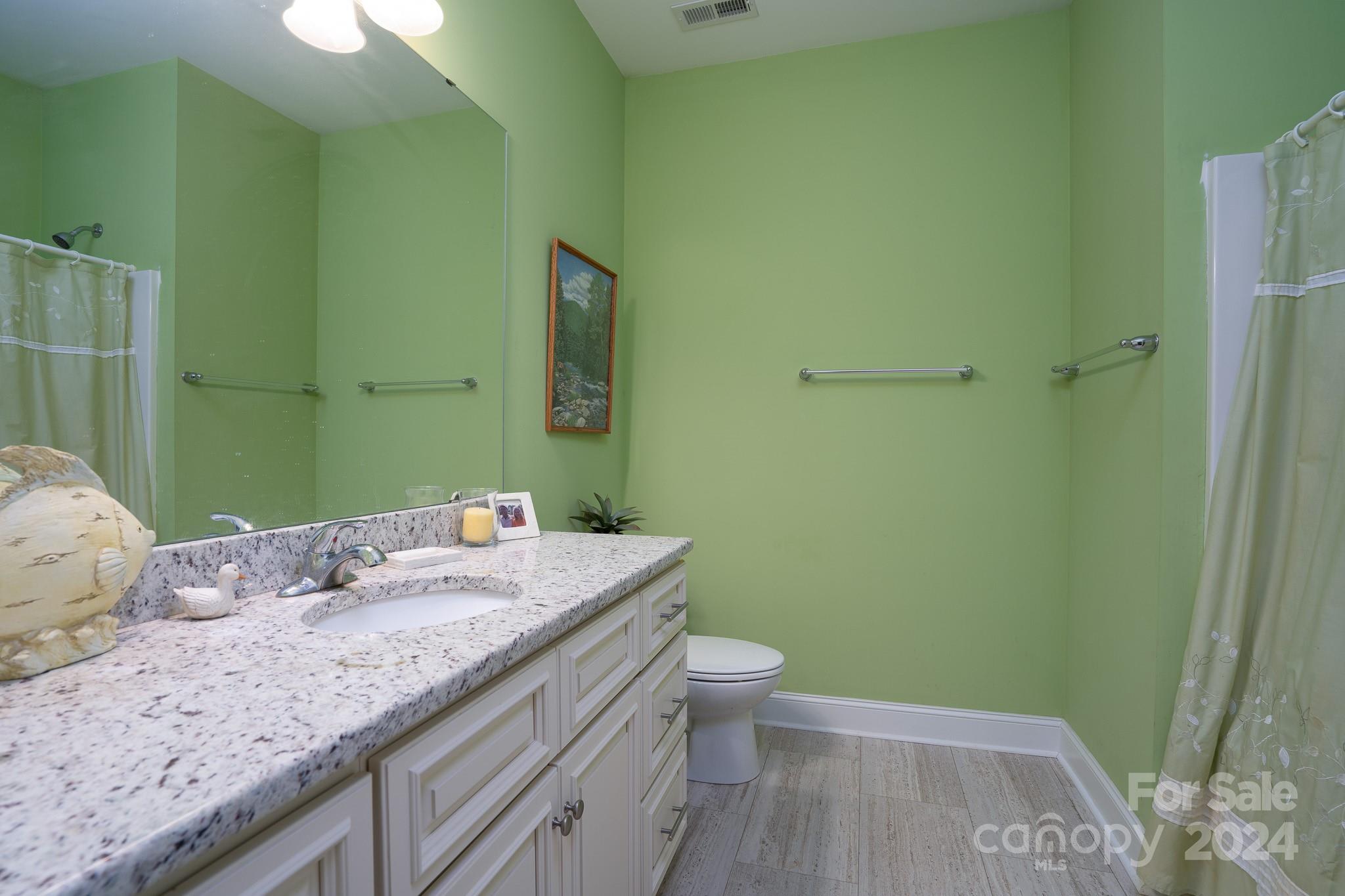 483 Pepperstone Drive Salisbury, NC 28146 - Photo 11 of 35 a bathroom with a granite countertop sink a toilet and a mirror