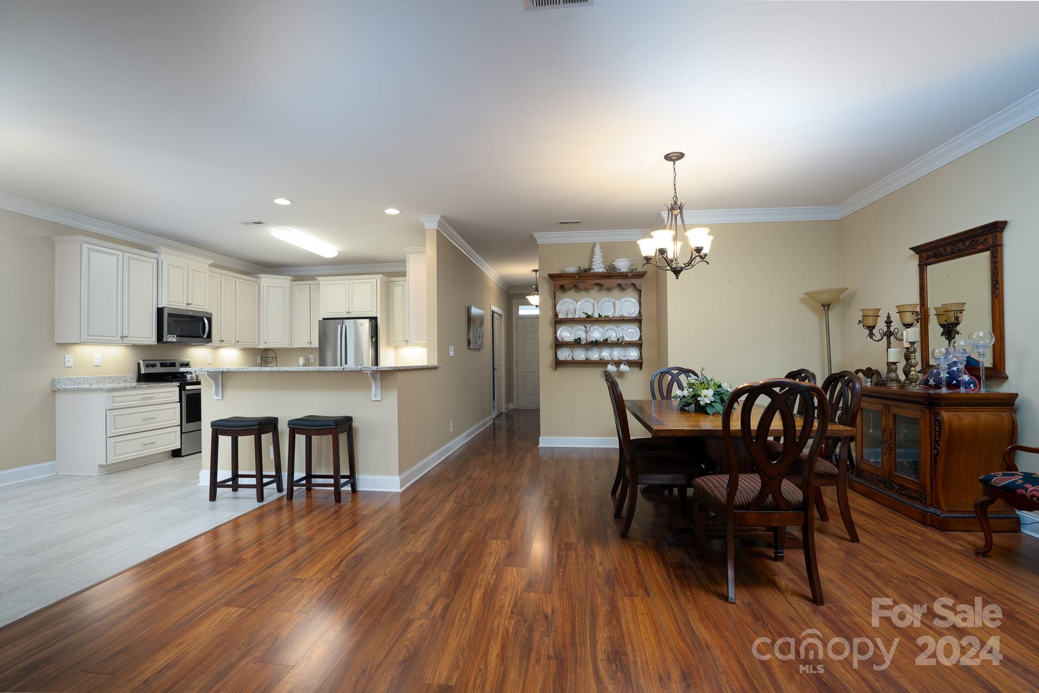 483 Pepperstone Drive Salisbury, NC 28146 - Photo 17 of 35 a view of a dining room with furniture and wooden floor