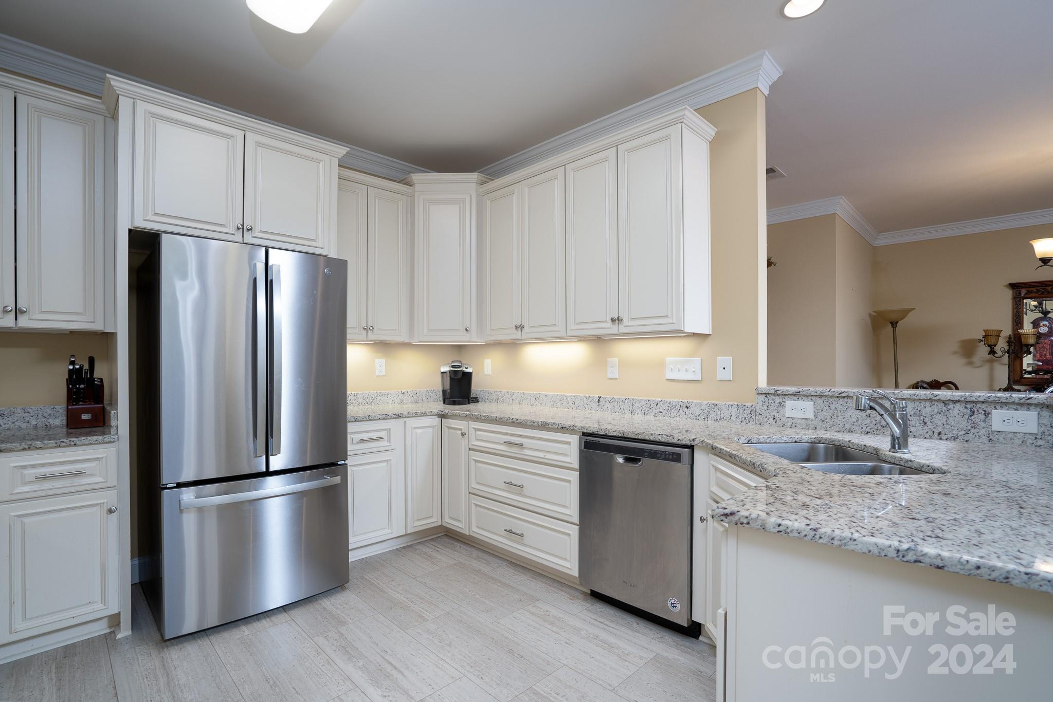 483 Pepperstone Drive Salisbury, NC 28146 - Photo 20 of 35 a kitchen with stainless steel appliances granite countertop a refrigerator sink and cabinets