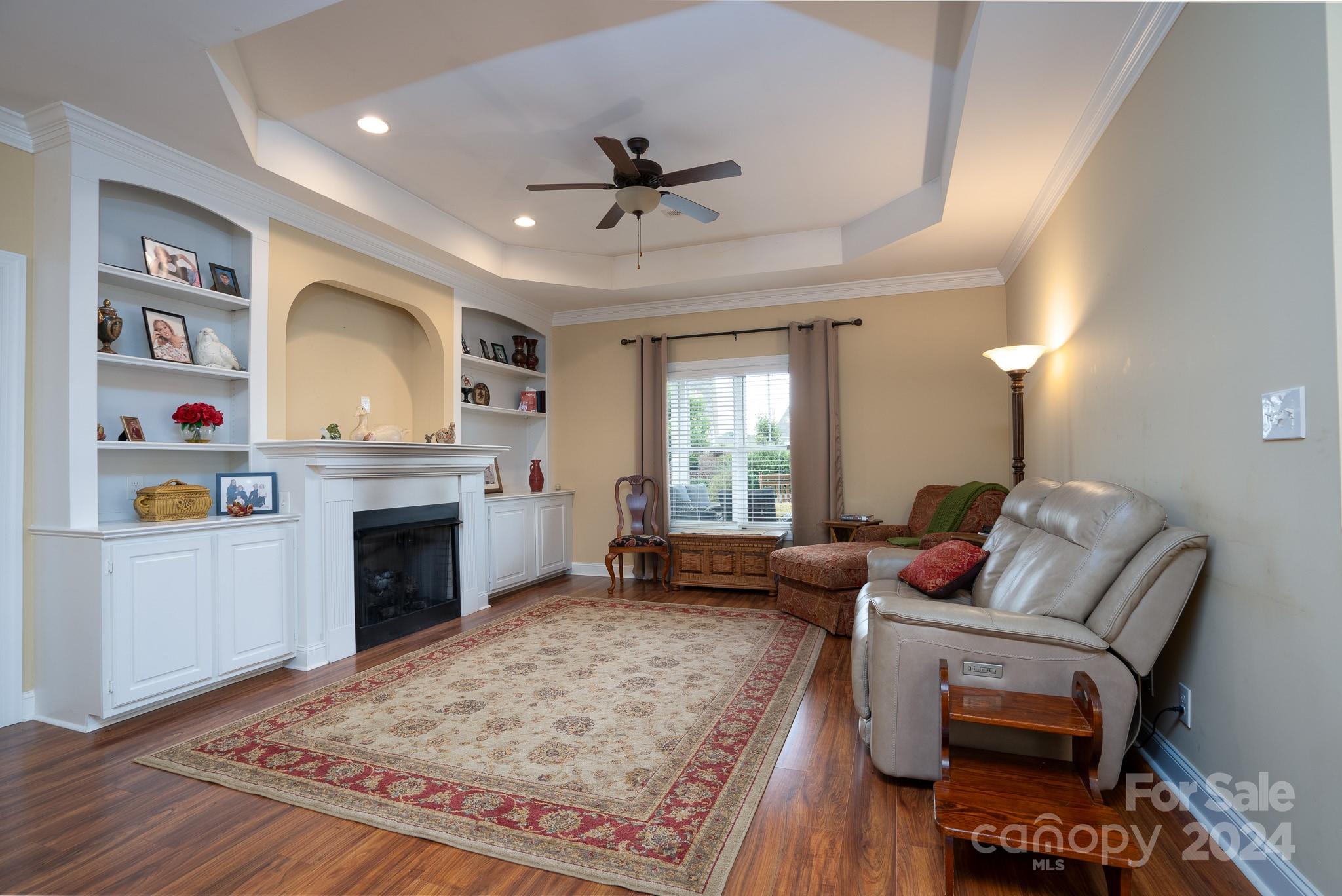 483 Pepperstone Drive Salisbury, NC 28146 - Photo 23 of 35 a living room with furniture and a fireplace