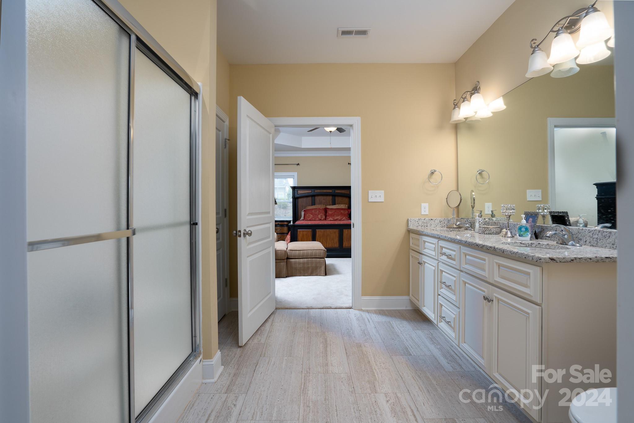 483 Pepperstone Drive Salisbury, NC 28146 - Photo 28 of 35 a bathroom with a double vanity sink and a mirror