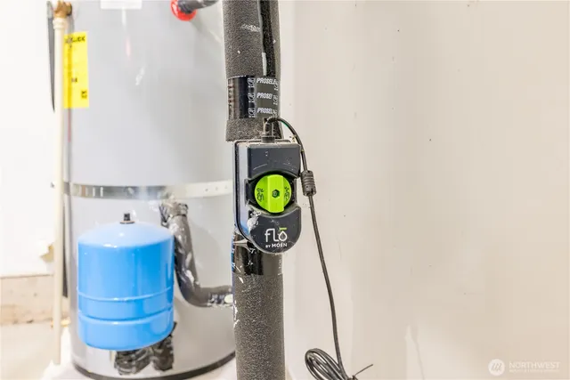 a bathroom with a sink mirror and vanity