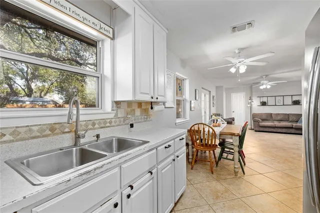 a kitchen with a sink cabinets and counter space