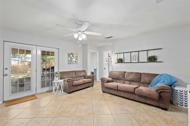 a living room with furniture and a window
