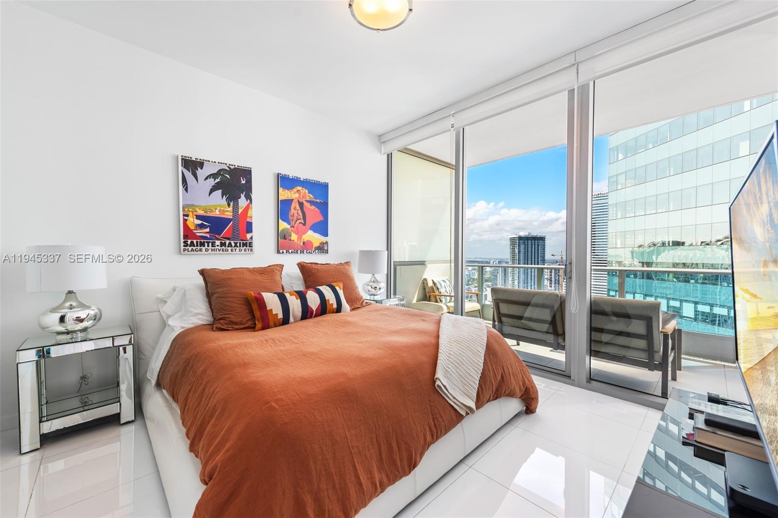 200 Biscayne Blvd Way, Unit 4511 Miami, FL 33131 - Photo 11 of 20 a bedroom with a bed and a large window with outer view