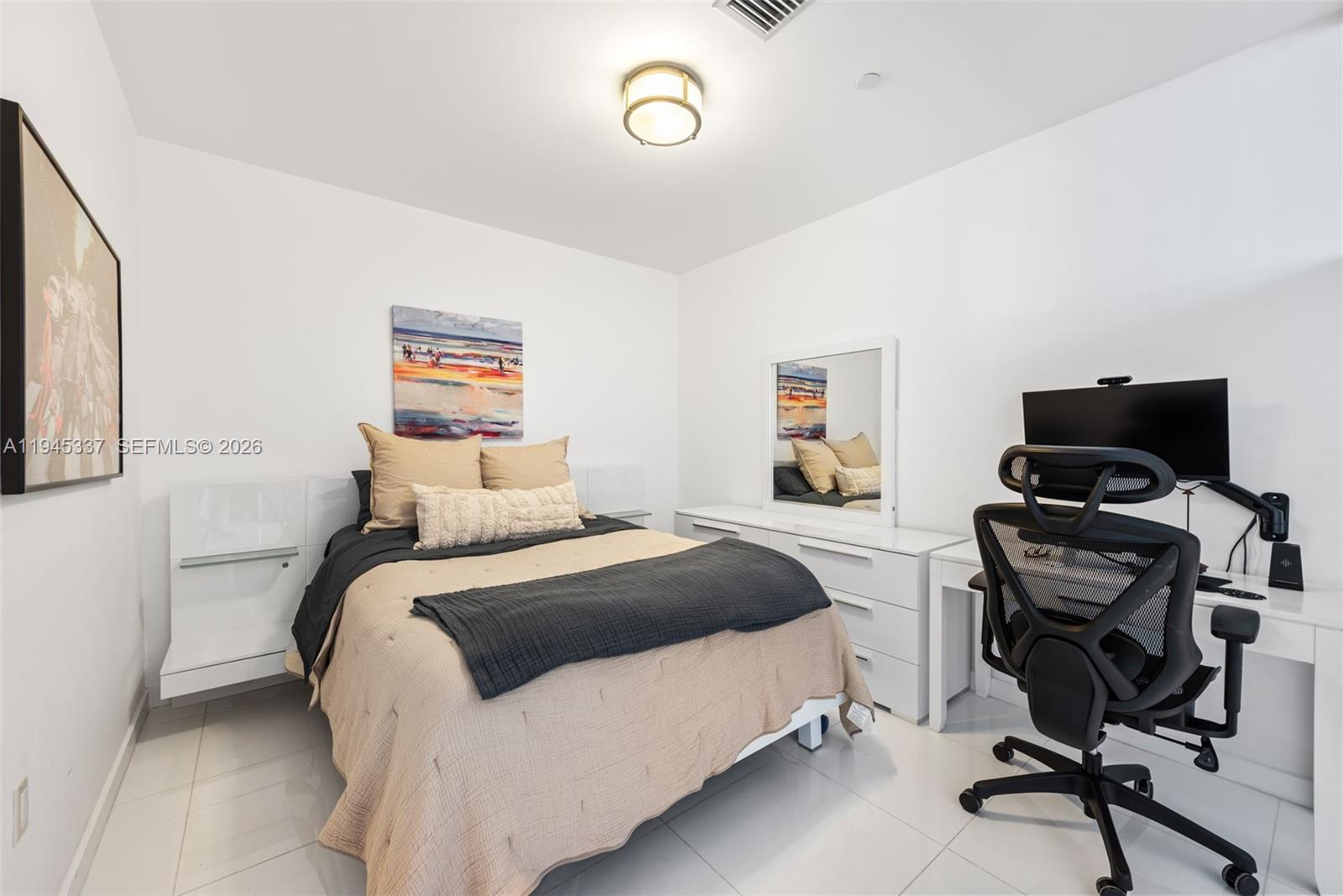 200 Biscayne Blvd Way, Unit 4511 Miami, FL 33131 - Photo 13 of 20 a bedroom with a bed and a desk