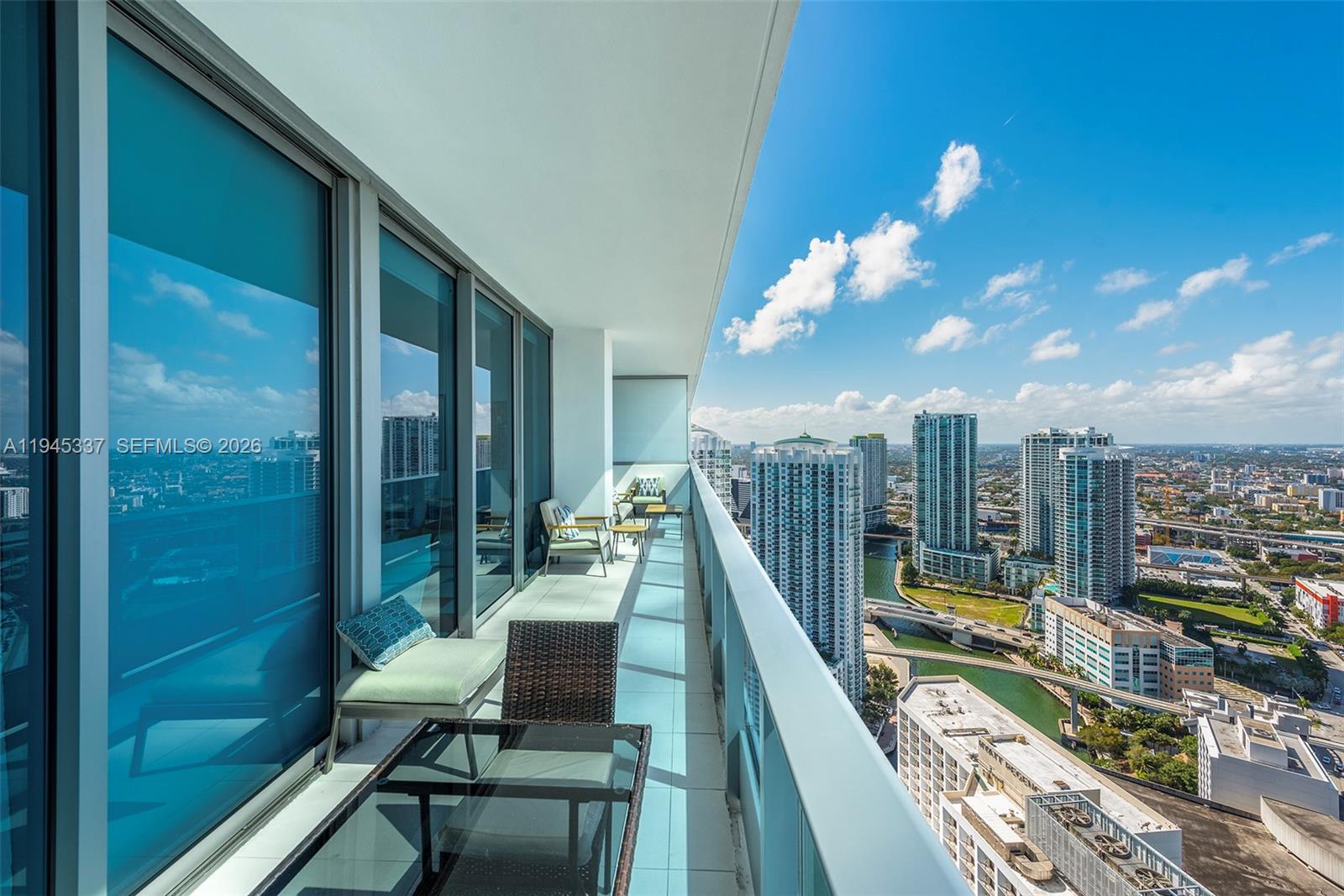 200 Biscayne Blvd Way, Unit 4511 Miami, FL 33131 - Photo 19 of 20 a view of a balcony with furniture