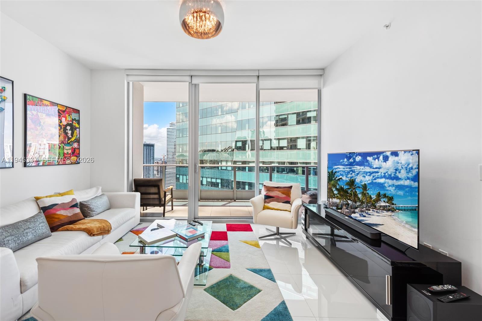 200 Biscayne Blvd Way, Unit 4511 Miami, FL 33131 - Photo 3 of 20 a living room with furniture and a floor to ceiling window