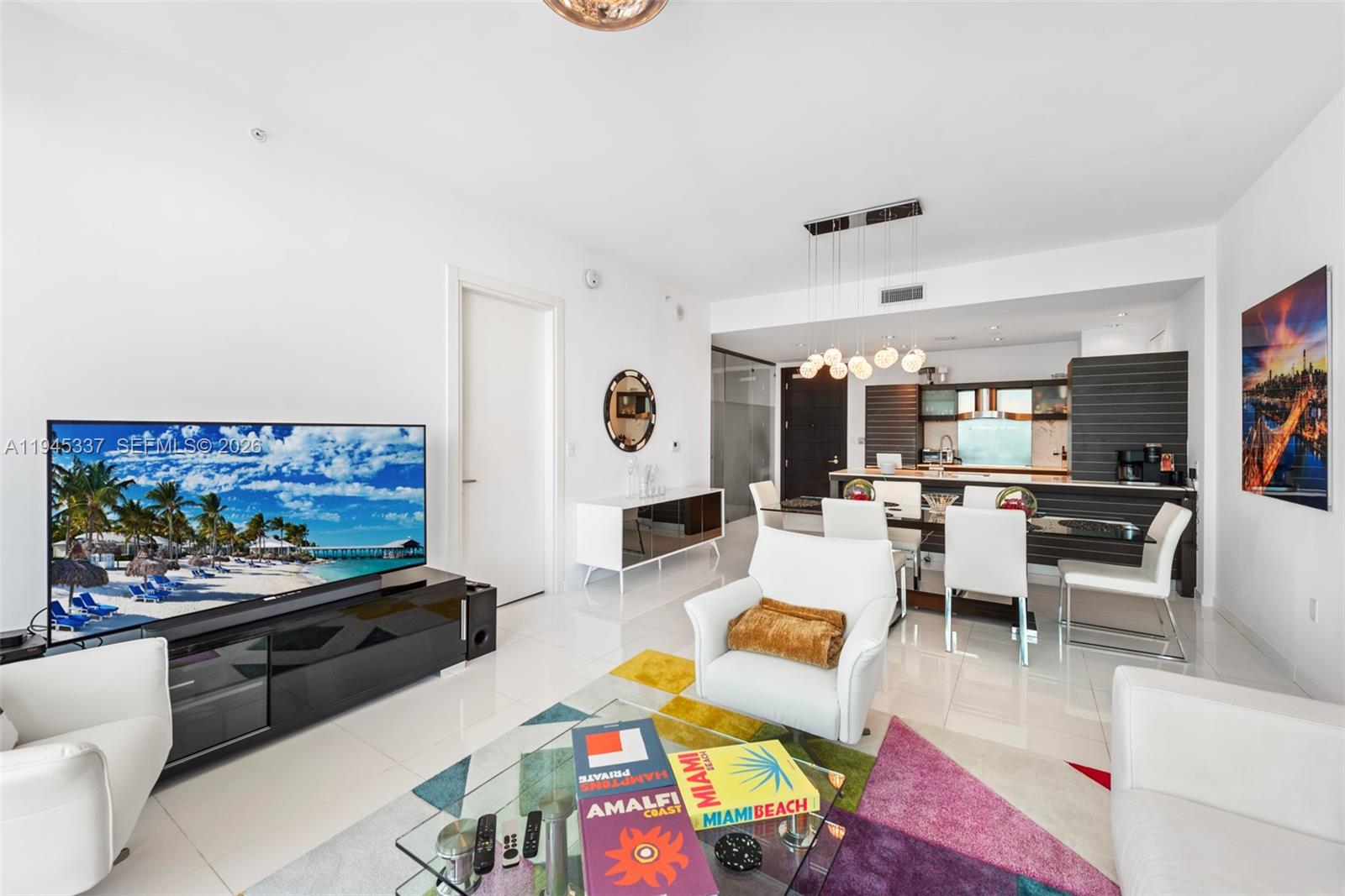 200 Biscayne Blvd Way, Unit 4511 Miami, FL 33131 - Photo 5 of 20 a living room with furniture and a flat screen tv