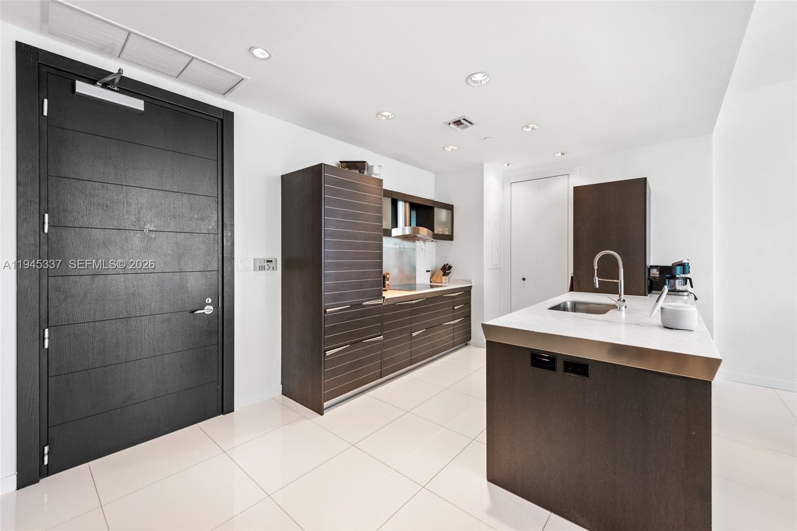 200 Biscayne Blvd Way, Unit 4511 Miami, FL 33131 - Photo 7 of 20 a bathroom with a sink and a mirror