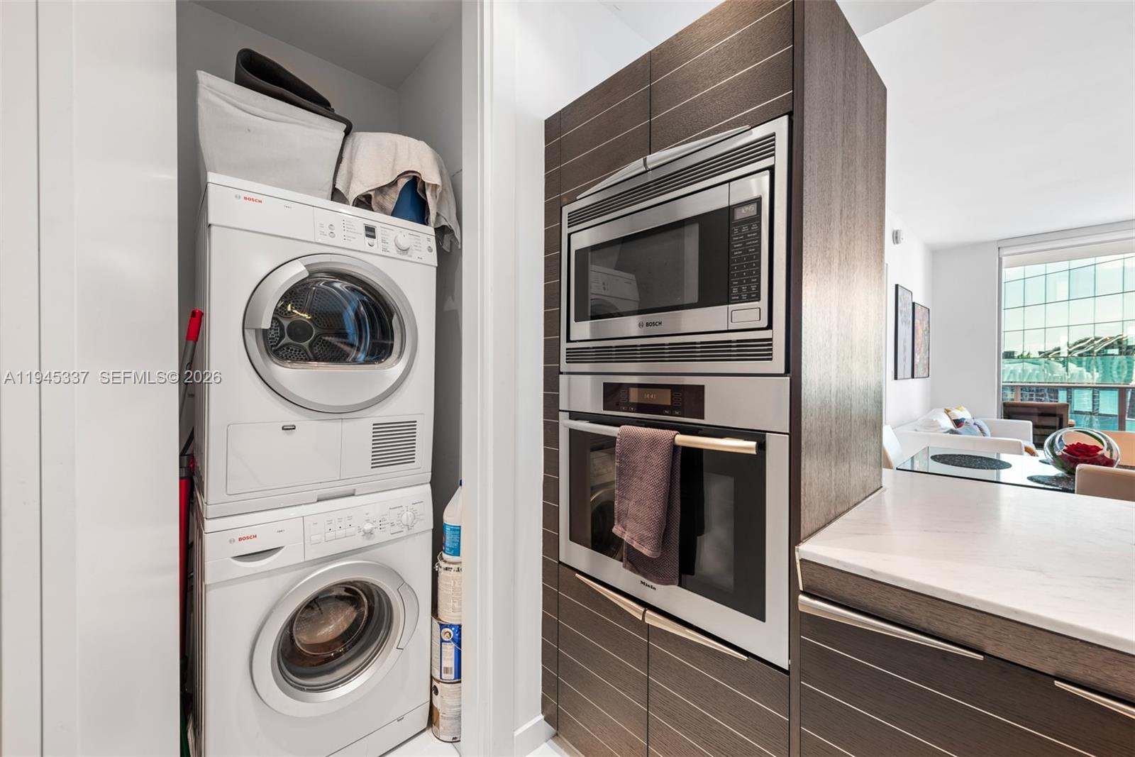 200 Biscayne Blvd Way, Unit 4511 Miami, FL 33131 - Photo 10 of 20 a close up view of a washer and dryer in a kitchen