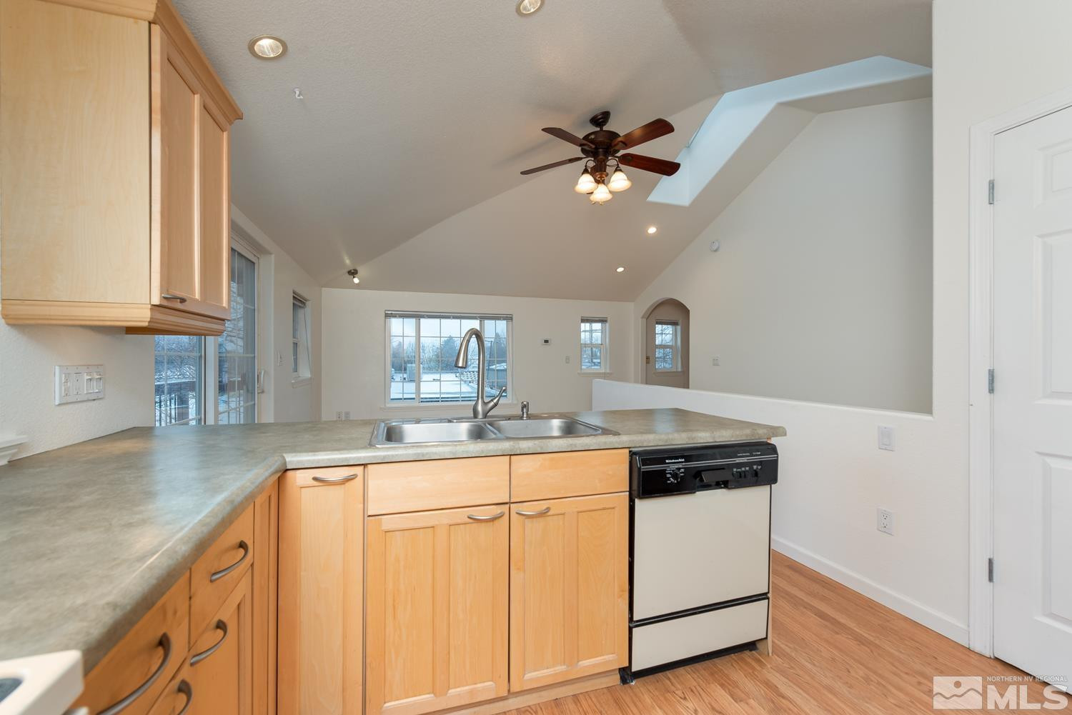 1290 Gordon Avenue Reno, NV 89509 - Photo 32 of 40 a kitchen with stainless steel appliances granite countertop a sink a stove and cabinets