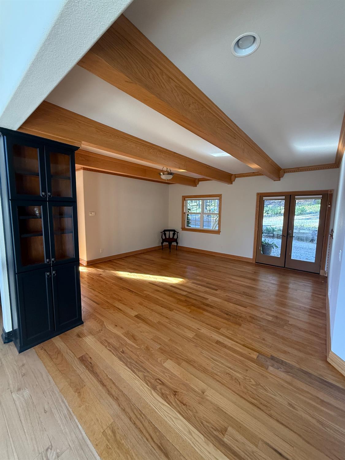 21293 Scotts Flat Road Nevada City, CA 95959 - Photo 17 of 62 en empty room with window and wooden floor
