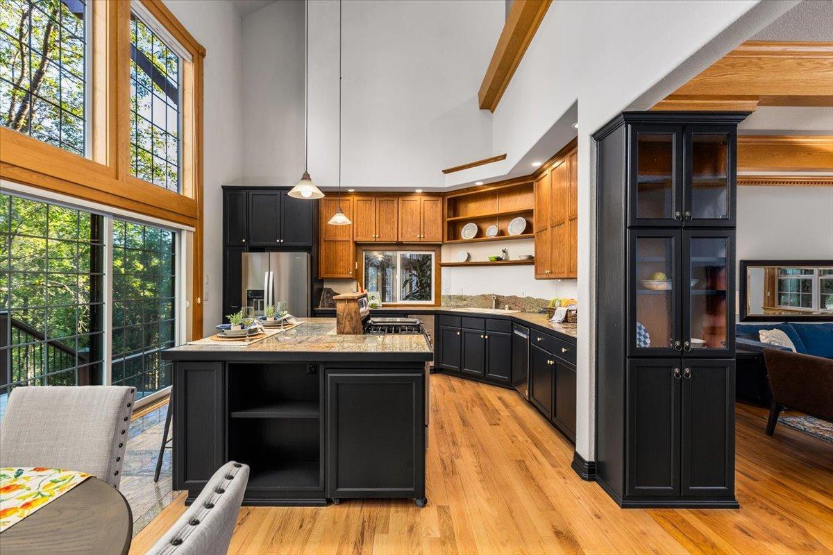 21293 Scotts Flat Road Nevada City, CA 95959 - Photo 20 of 62 a kitchen with stainless steel appliances granite countertop a stove and a refrigerator