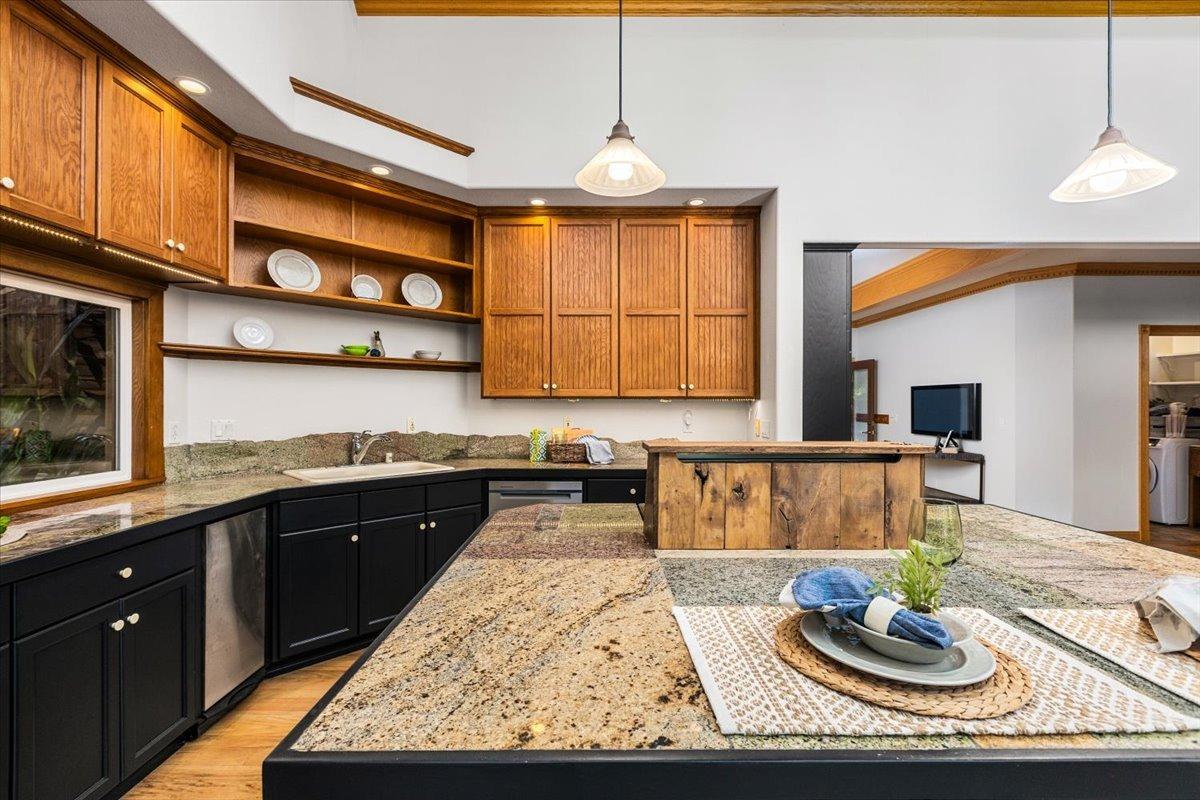 21293 Scotts Flat Road Nevada City, CA 95959 - Photo 21 of 62 a kitchen with stainless steel appliances granite countertop sink stove and cabinets