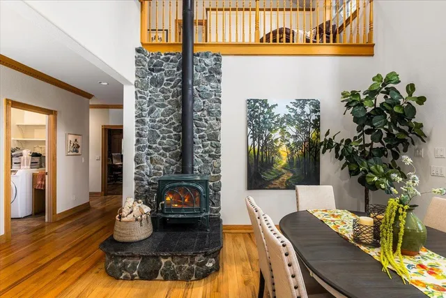 a living room with furniture and wooden floors