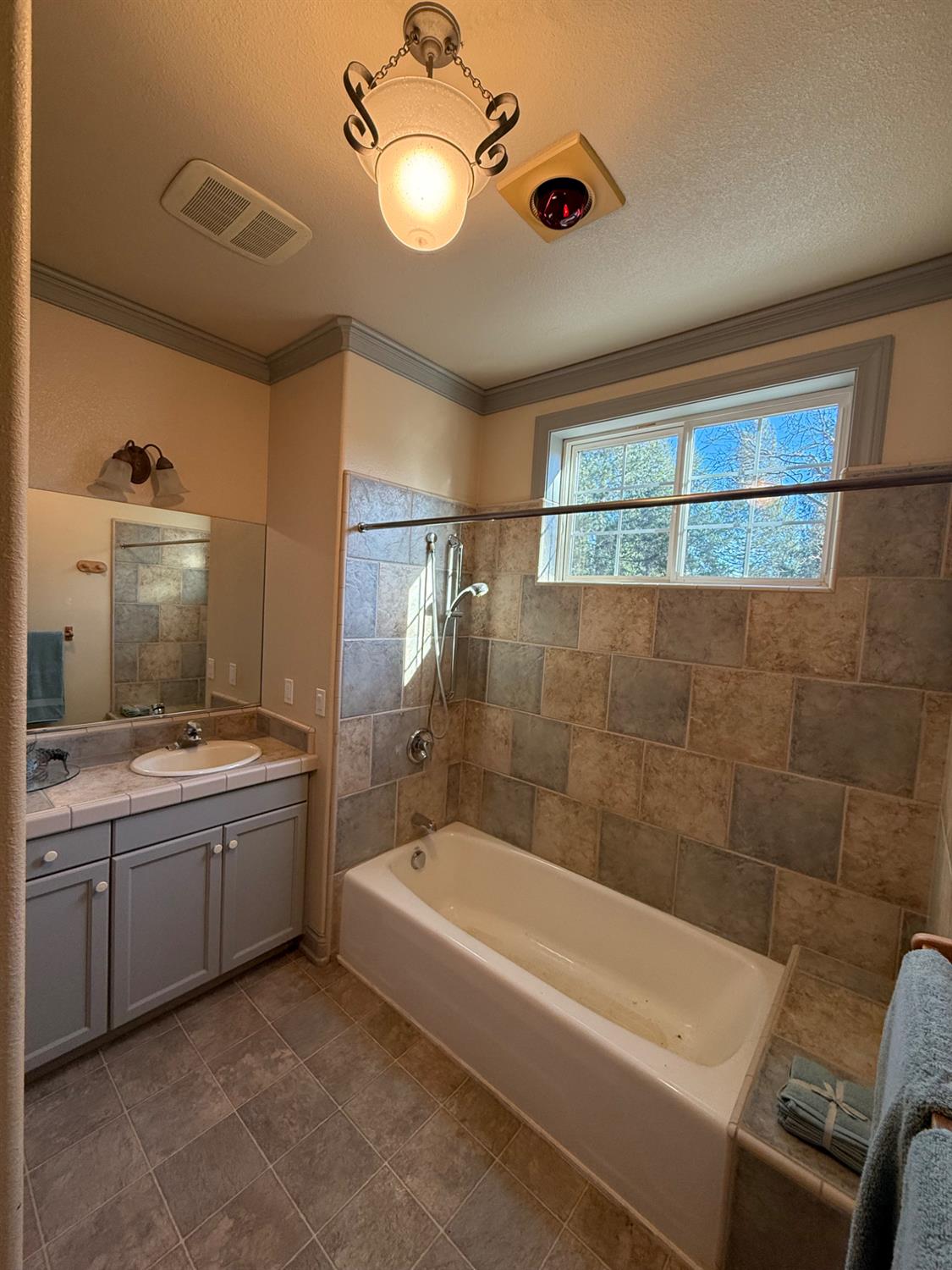 21293 Scotts Flat Road Nevada City, CA 95959 - Photo 29 of 62 a bathroom with a tub sink and mirror