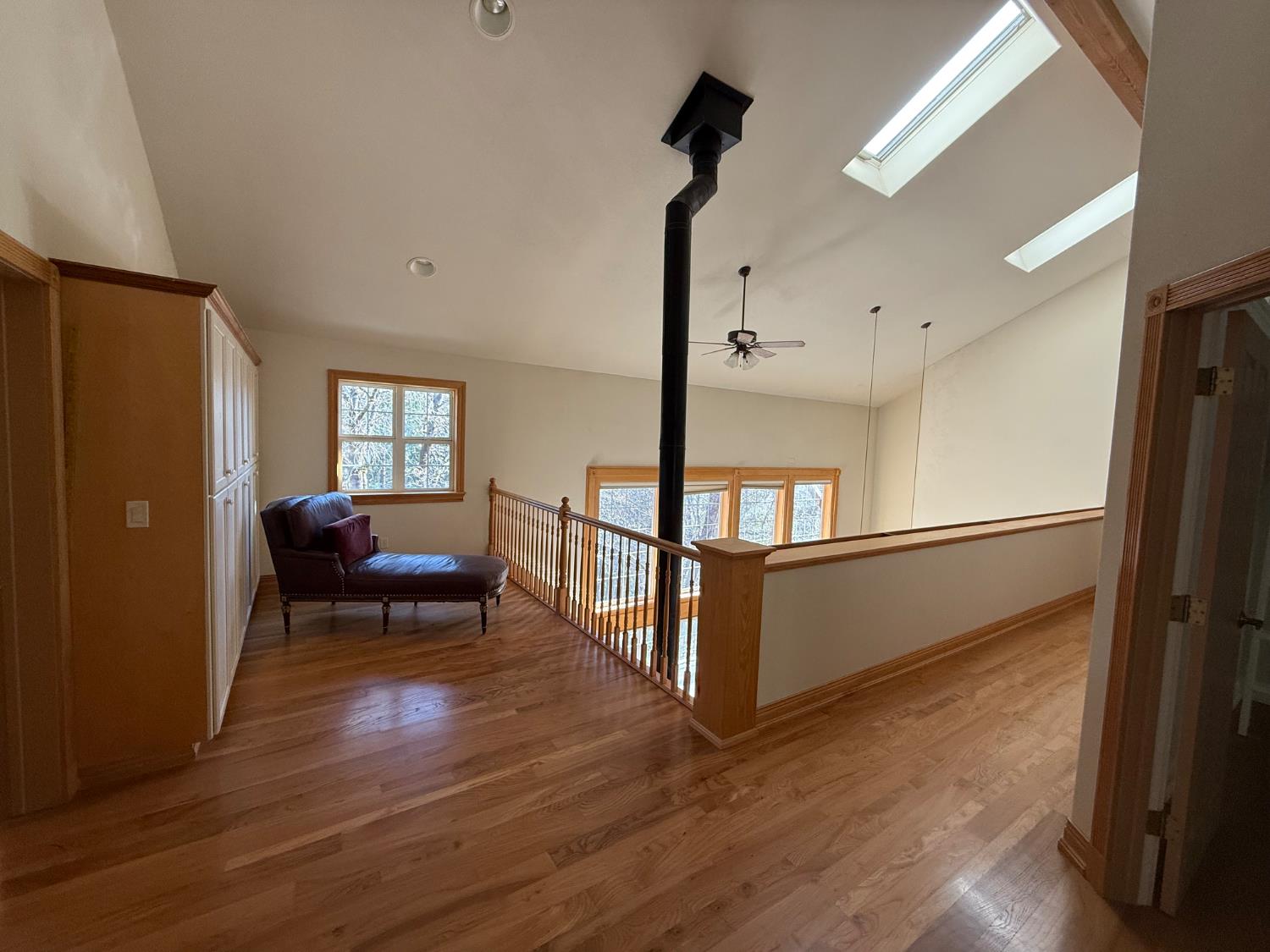 21293 Scotts Flat Road Nevada City, CA 95959 - Photo 32 of 62 a living room with furniture and a wooden floor