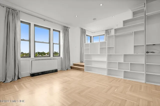 a bathroom with a sink vanity granite and shower